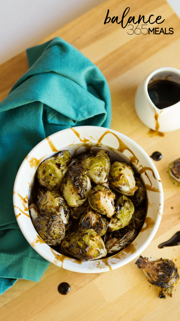 Balsamic Roasted Brussel Sprouts - Change the way your family feels about brussel sprouts by roasting them until caramelized and drizzling them with a sweet honey balsamic glaze. You’ll never go back to boiling brussel sprouts again! Easy and simple but makes a fancy side dish. Keep the leftover glaze in your fridge to drizzle over toast, sliced fruit, or any roasted veggie!